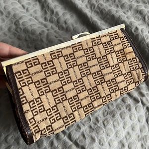 Original vintage Givenchy clutch. With logo pattern.